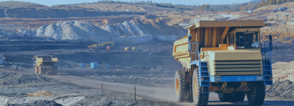 Trucks removing material from a mine